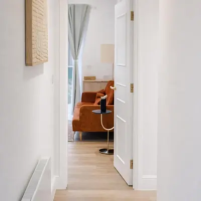 a hallway with a door leading to a living room at Spacious 2BR Designer Home in Newmarket , Private Grounds & Garden in Newmarket