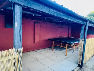 a ping pong table sitting inside of a building at Louisville Flat 3 in Newmarket