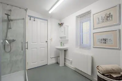 a bathroom with a shower and a sink at Keralia in Wivenhoe