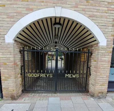 an entrance to a building with a black gate at Charming 1-Bedroom Flat - Chelmsford City Centre in Chelmsford
