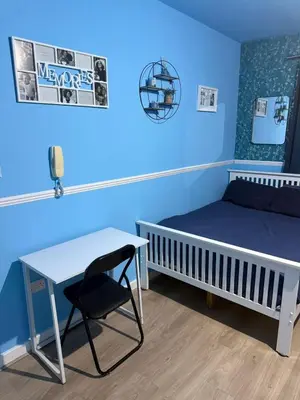 a bedroom with a bed and a desk and a table at The Aqua Stay By Cambridge City Centre in Chesterton