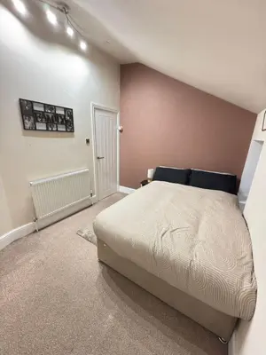 a bedroom with a large bed in a room at The Modern Nest By Cambridge Central Station in Cambridge