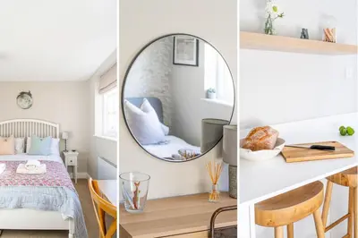 a room with a mirror and a bed and a table at 2 Truman Lodge in Thorpeness
