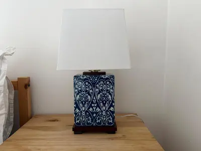 a blue and white lamp sitting on a table at Entire House with Garden and Office in Milton