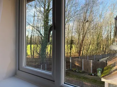 a window with a view of a yard at Entire House with Garden and Office in Milton
