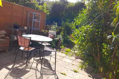 a table and chairs sitting on a patio at Lovely artist's home ecently refurbished in CBG
