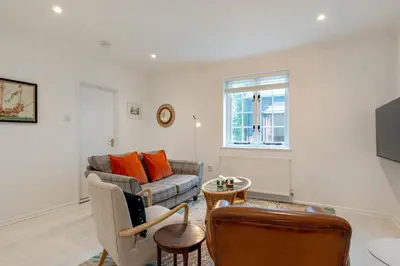 a living room with a couch and a window at 2 Bed in Scole oc-p34354 in Scole