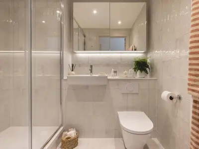 a bathroom with a shower and a toilet and a sink at Charles Hope Cambridge in Cambridge