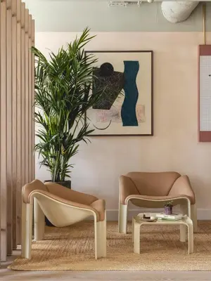 a living room with two chairs and a table at Charles Hope Cambridge in Cambridge