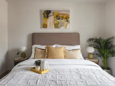 a bedroom with a large white bed with pillows at Charles Hope Cambridge in Cambridge