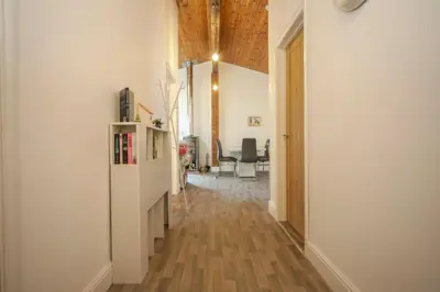 a hallway with a white refrigerator in a room at A12 & A14 Location - Suffolk IP3 - Secure Parking x3 in Nacton