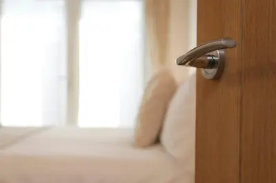 a wooden door with a handle in a bedroom at A12 & A14 Location - Suffolk IP3 - Secure Parking x3 in Nacton