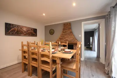 a kitchen and dining room with a wooden table and chairs at Ideal Contractor & Family Stay-Basildon Smart tv in Nevendon