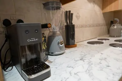 a blender sitting on a counter in a kitchen at Premium 3BR House - Loughton - by Rent Squared LTD in Loughton