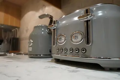 a toaster sitting on a counter in a kitchen at Premium 3BR House - Loughton - by Rent Squared LTD in Loughton