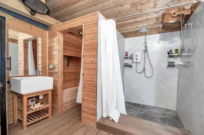 a bathroom with a shower and a sink at Luxury Spa Mansion With Heated Pool and Spa Facilities in Stanningfield
