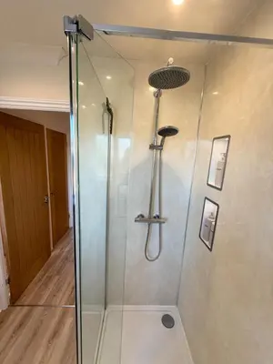 a shower with a glass enclosure in a bathroom at The Waldegraves Hideaway in Bures Saint Mary