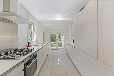 a kitchen with white counters and a stove at Stunning 2Bed Central Home in Cambridge