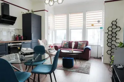 a living room with a couch and a table at 1BR Super King sized Apartment Contractor friendly - Free Parking! in Southend-on-Sea