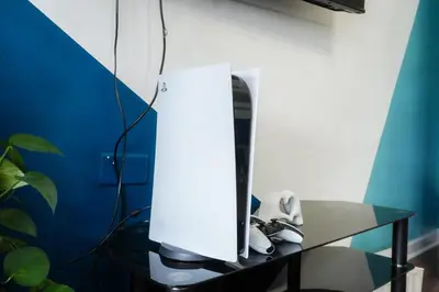 a white monitor on a glass table in a room at 1BR Super King sized Apartment Contractor friendly - Free Parking! in Southend-on-Sea