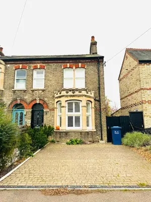 a brick house with a driveway in front of it at Central Cambridge with Free Parking and Pets welcome in Chesterton