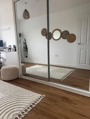 a room with a glass door and a mirror at 2 Bed apartment- Laindon in Great Burstead
