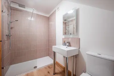 a bathroom with a sink and a shower at Hare View, part of The Garden House in Kenninghall