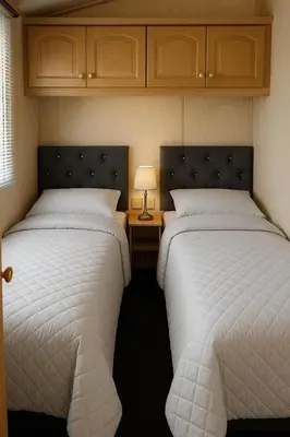 two beds sitting next to each other in a bedroom at Rohannah A and C Ultimate Retreat in Colchester