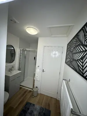 a bathroom with a toilet sink and a shower at Rosern Short Stays in St Ives