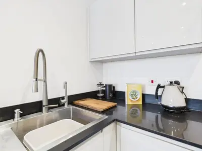 a kitchen with a sink and a counter top at Mid-Long Stay 1 Bedroom Apartment Great Baddow in Great Baddow