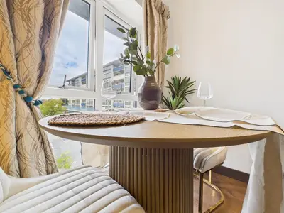 a table in a room with a window at Mid-Long Stay 1 Bedroom Apartment Great Baddow in Great Baddow