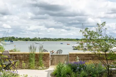 a view of a body of water with boats in it at Quayside Cottage in Waldringfield