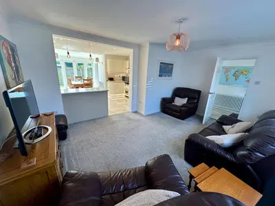 a living room with a couch and a chair at Detached, 5 Double Bedrooms, 3 En-Suites, 5 Car Parking in Lexden