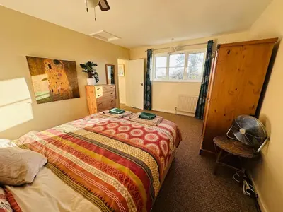 a bedroom with a bed and a window at Family Country Home in Stoke Ferry