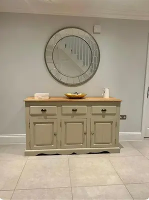 a dressing table with a mirror on the wall at Haggard House Stock in Stock