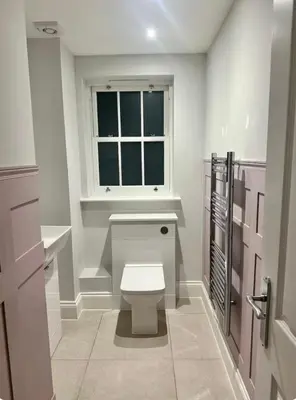 a bathroom with a toilet and a window at Haggard House Stock in Stock