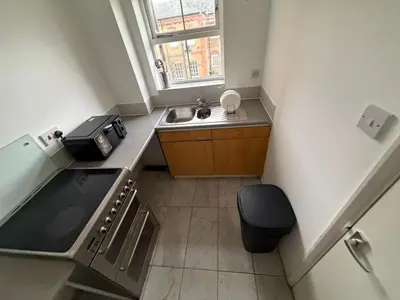a small kitchen with a sink and a window at BMC Serene Spacious 1BR Flat in Enfield