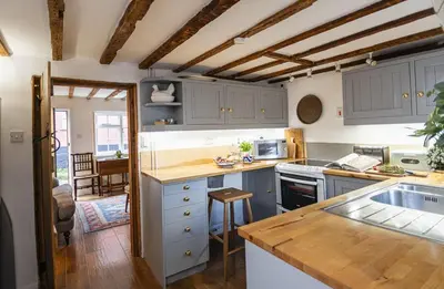 a kitchen with blue cabinets and a counter top at 4 Angel Lane in Woodbridge
