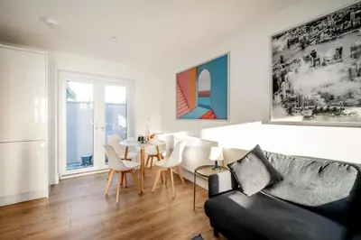 a living room with a couch and a table at Garden Cottage, Leiston, near Sizewell - Ideal for a short or long term corporate lets - Managed by Aldeburgh Coastal Cottages in Leiston