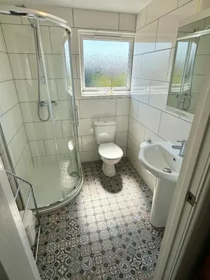 a bathroom with a shower and a toilet and a sink at Detached, 4 Double Rooms, 2 En-Suites, 5 Car Parking in Lexden