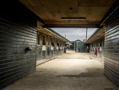 an empty alley in a building with people standing inside at Buzzards Retreat in Larling