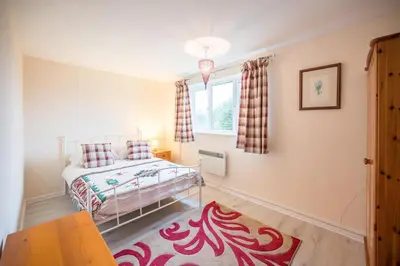 a small bedroom with a bed and a window at 1 Hall Farm Cottage, Aldeburgh in Aldeburgh