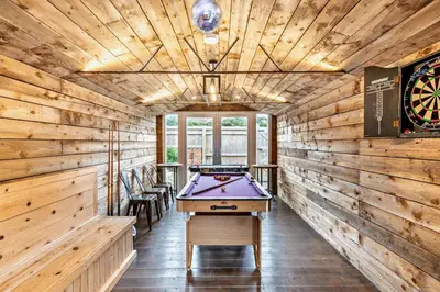 a pool table in a room with wooden walls at 3 Bed in Felixstowe oc-s27808 in Felixstowe