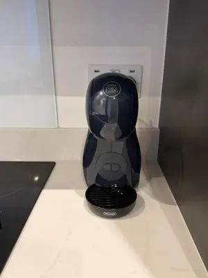 a black appliance sitting on top of a counter at Luxury Modern Apartment in Central Chelmsford in Chelmsford