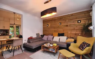 a living room with a couch and a table at House in Harold Wood in Harold Wood