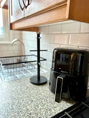 a toaster oven sitting on a counter in a kitchen at The Opulent Property Project Southend 4 Bed Sleeps 7 in Southend-on-Sea