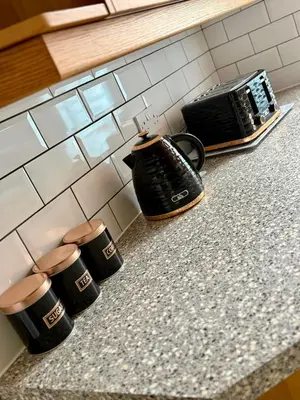 a kitchen counter with two coffee cups and a toaster at The Opulent Property Project Southend 4 Bed Sleeps 7 in Southend-on-Sea