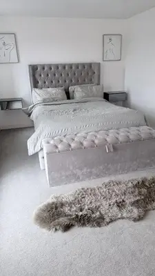 a bedroom with a large bed and a furry rug at Private Kingsize Bedroom in Horndon on the Hill