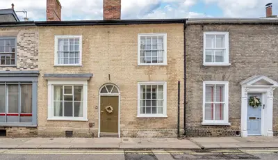 a brick house with white windows and a door at Charming Guildhall street - sleeps up to 6 guests in the Medieval Grid in Bury Saint Edmunds