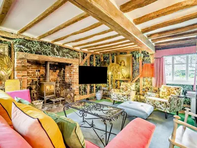 a living room filled with furniture and a tv at 4 Bed in Eye- oc-34389 in Thornham Magna